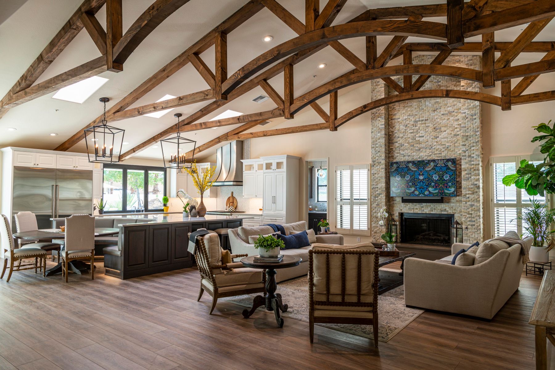 Interior of a shed home with exposed timber trusses and an open-plan living area